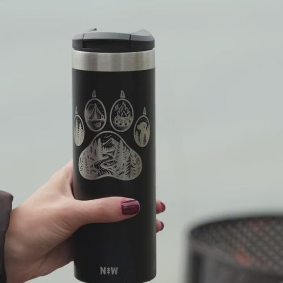 Trailmark tumbler by the sea: sipping, a golden retriever and a campfire