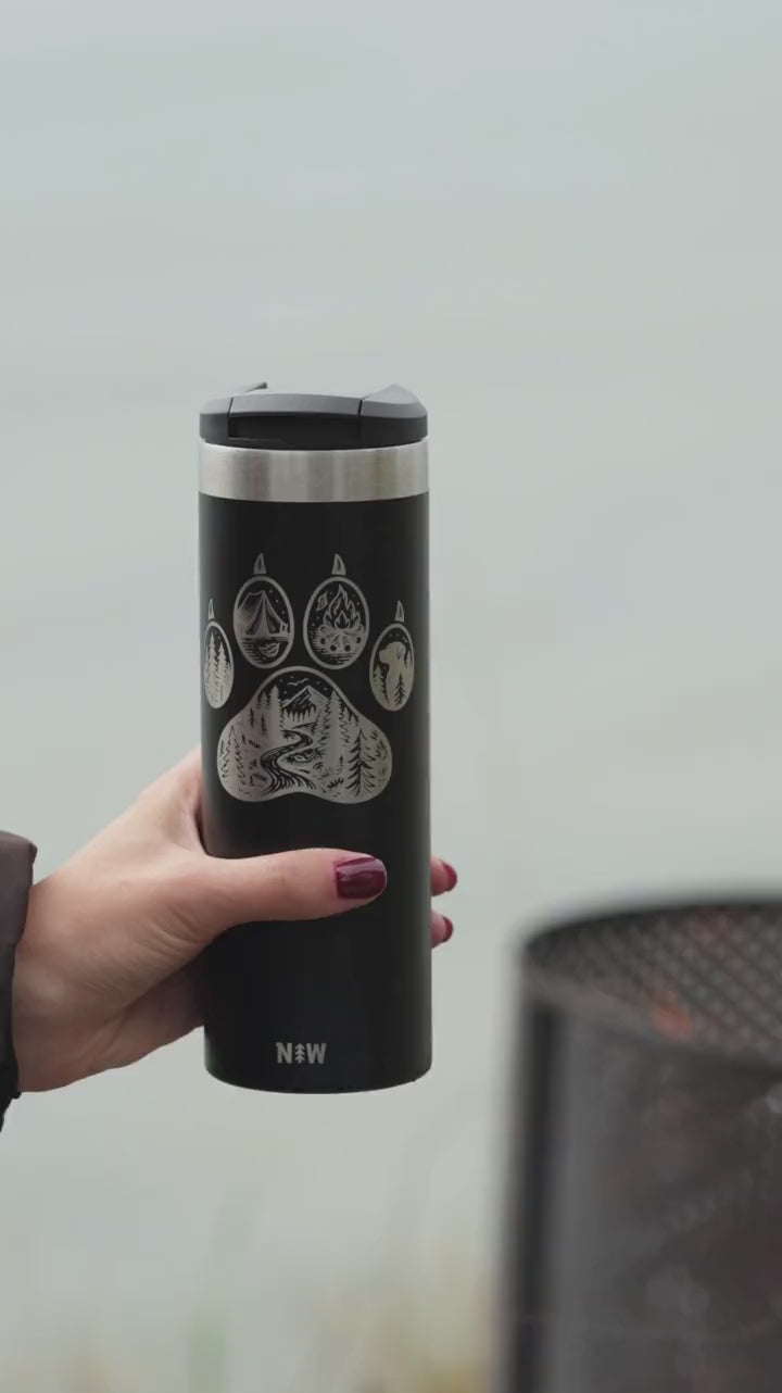 Trailmark tumbler by the sea: sipping, a golden retriever and a campfire